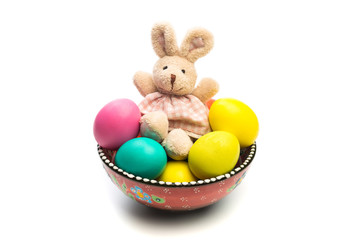 easter eggs in painted plate with little bunny