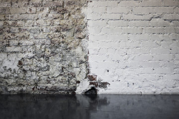 old white brick wall in loft style and black glossy floor