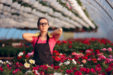 Woman Suffering Injuries While Working in Floral Greenhouse - obrazy, fototapety, plakaty