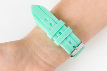 Silicone strap aquamarine color on the female wrist.