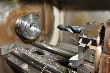 Large drill set in the CNC machine to create holes. Close-up