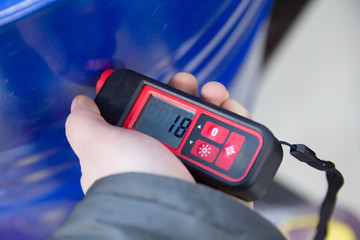 a device for measuring the paint layer