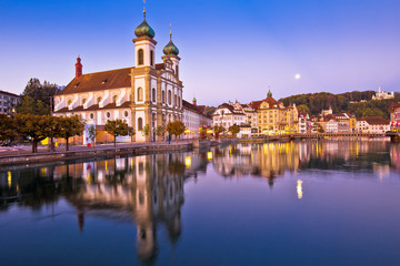 Fototapeta na wymiar Luzern church and Reuss river waterfront dawn view