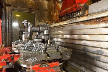 The body for creating the valve is installed on the table of the CNC machine for creating and grinding holes