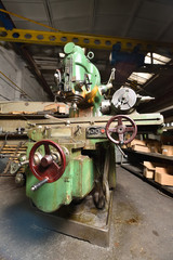 Very old CNC machine for processing metal parts, retro style.