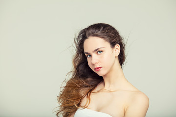 Model beautiful young girl with blond hair and blue eyes fashionable portrait in the Studio