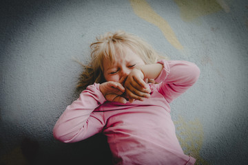 little girl crying on the floor, kids depression, child abuse