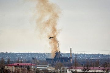 Military Helicopter over the city, Donbass war Ukraine