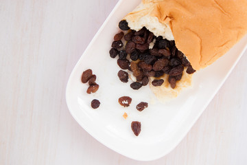 Raisins in bread put on the plate in the moring fastfood for energy in the day 