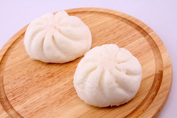 Steamed buns on the wooden floor.