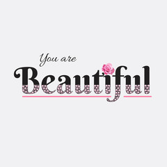 You are beautiful - slogan with roses and pink pearls. Beautiful print for t-shirts, textiles and postcards. The text is written with crystals on white background. Vector illustration.