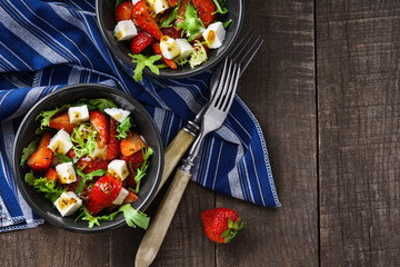 Vegetarian salad with strawberry, tofu and aragula overhead shot