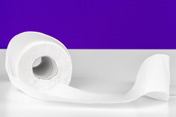 Roll of toilet paper or tissue  on color background