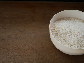 white rice in a wooden bowl