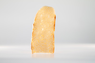 The purity and simplicity of homemade bread with slices and knife on black background
