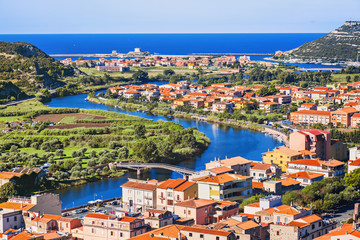 Fototapeta na wymiar Italian vacations. Beautiful view of Bosa town with sea at background. Sardinia island, Italy. Popular travel destination