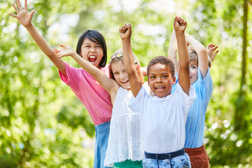 Multicultural Group Kids cheers enthusiastically