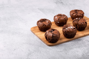 Tasty chocolate muffins on the blue plate