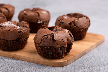 Tasty chocolate muffins on the blue plate