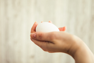 White egg in hand