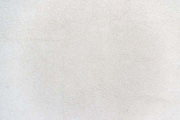 Fototapeta na wymiar Verputz eines Gebäudes in schlichtem und gedeckten weiß mit Rauputz