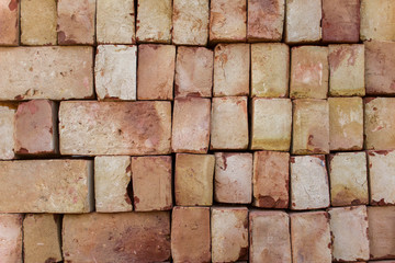 white red bricks lie on flat rows. rough surface texture