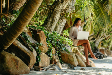 Woman freelancer on the beach