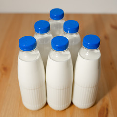 milk bottles on wooden table