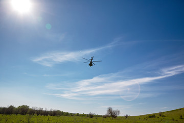 Fototapeta na wymiar Landscape with Military Helicopter
