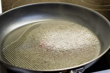 Boiling water in hot frying pan