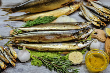 smoked fish mackerel or scomber on a white parchment paper, close-up, top view