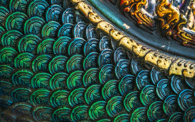Close up detailed shot of Thai pattern the king of naga or serpent statue at at Wat Rong Sua Ten or...