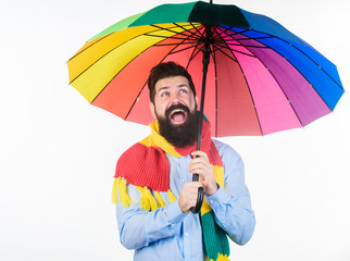 Rainy days can be tough to get through. Prepared for rainy day. Carefree and positive. Enjoy rainy day. Seasonal weather forecast. Man bearded hipster hold colorful umbrella. It seems to be raining