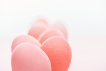 selective focus of pastel pink easter eggs