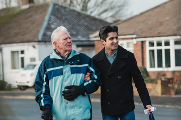 Teenager Helping his Grandfather