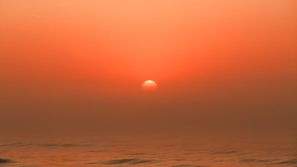 Beatiful red sunset over sea surface