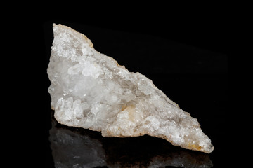 Macro mineral quartz snow stone on a black background
