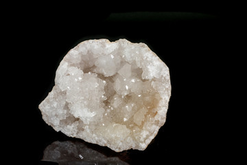 Macro mineral quartz snow stone on a black background