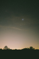 Fototapeta na wymiar light polluted sky with stars 