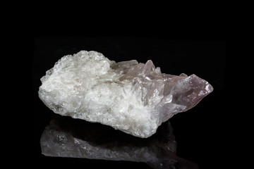 Macro mineral amethyst quartz stone on a black background