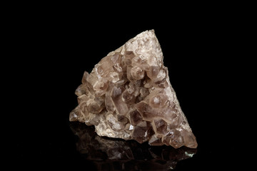 Macro mineral stone smoky quartz, rauchtopaz on a black background