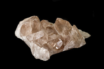 Macro mineral stone smoky quartz, rauchtopaz on a black background