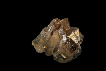 Macro mineral stone smoky quartz, rauchtopaz on a black background