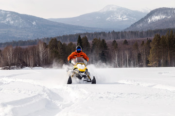 Athlete on a snowmobile.