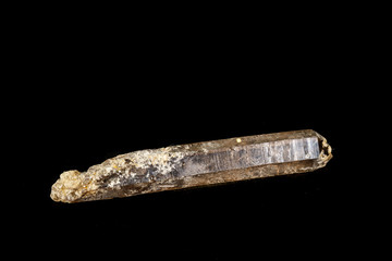 Macro mineral stone smoky quartz, rauchtopaz on a black background