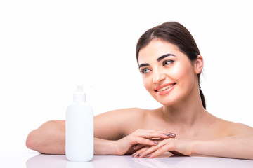 Obraz na płótnie Canvas Beauty concept. The caucasian pretty woman with perfect skin holding oil bottle at studio. The care, skin, treatment, health, spa, cosmetic concept