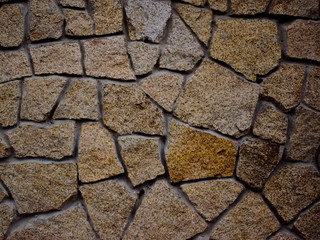 Wall is lined with natural stone