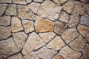 Wall is lined with natural stone