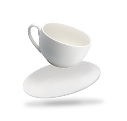 one white mug and saucer fly isolated on white background