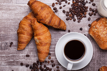 Delicious croissants on vintage wooden table